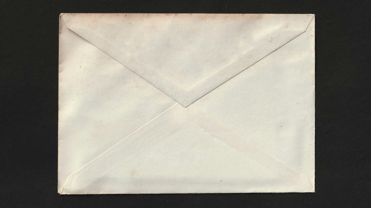 A plain white envelope on a black background.