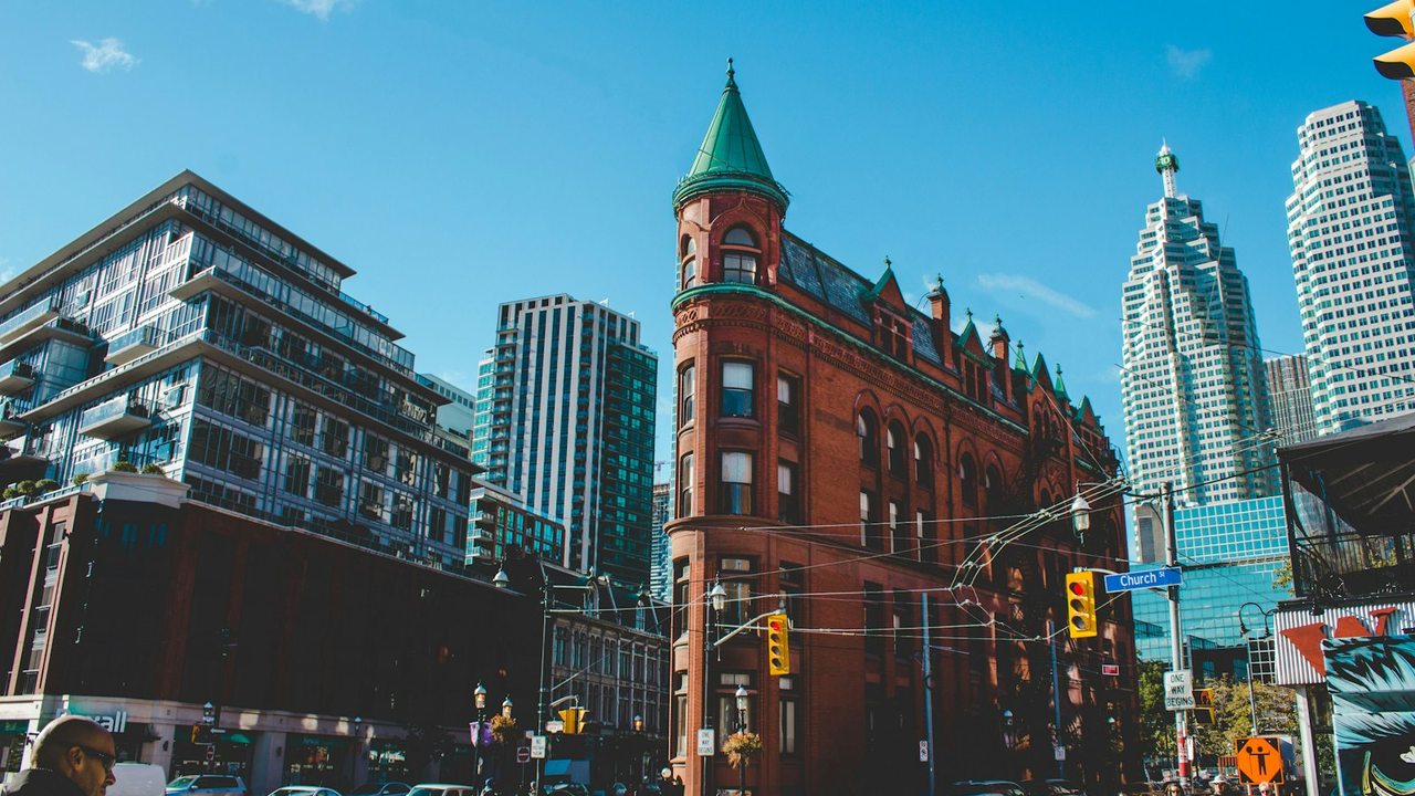The Gooderham Building in Toronto, with downtown office towers behind it.
